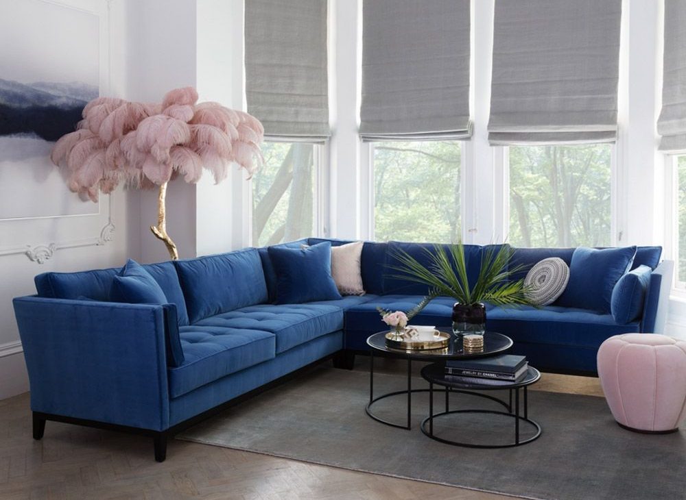 Blue Velvet Corner Sofa with Ostrich feather lamp in the corner