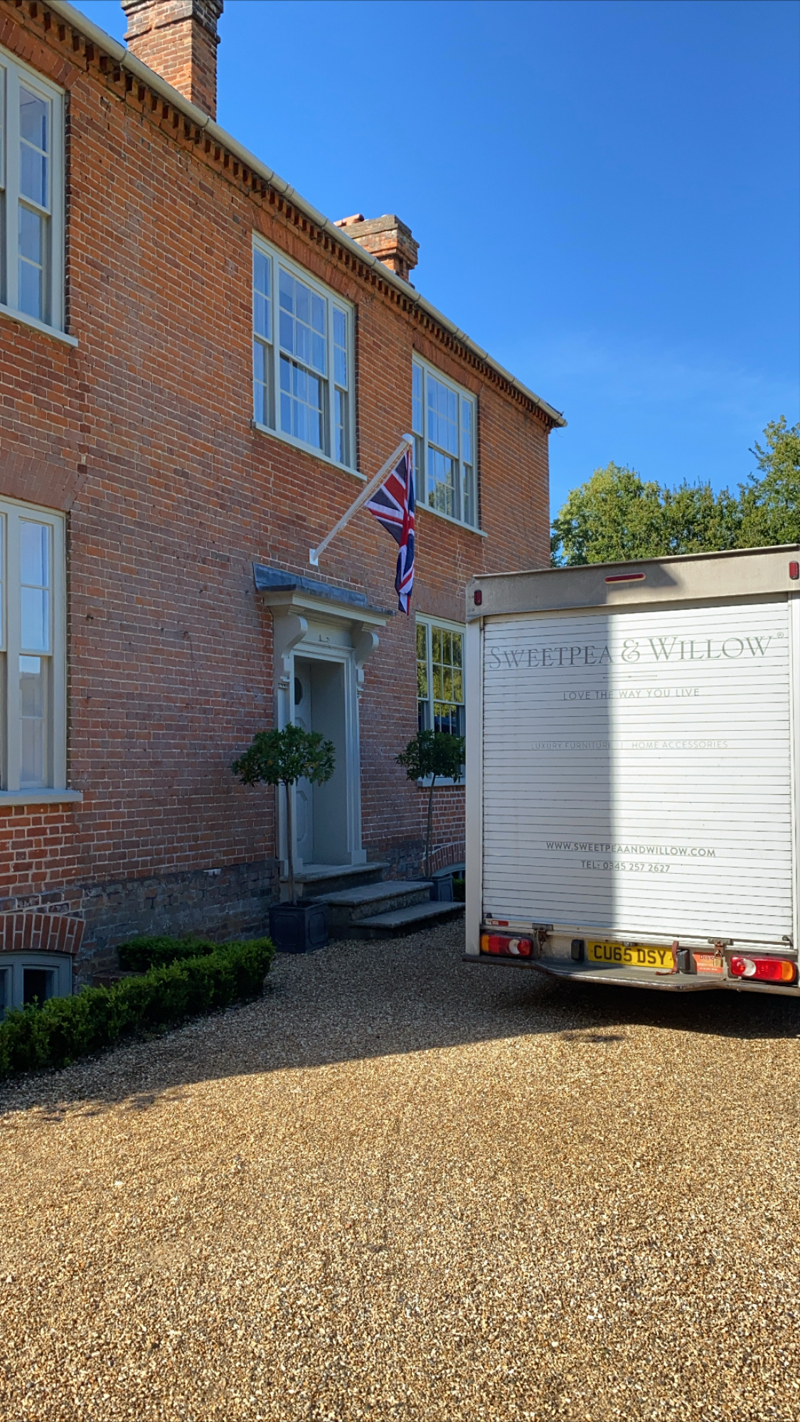 outside the doorway of a luxurious home