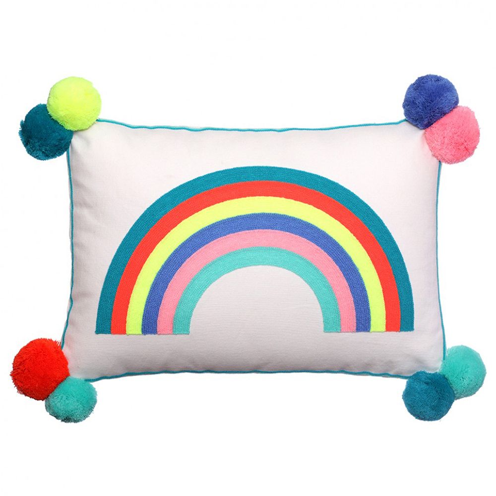 a square rainbow cushion with pompoms