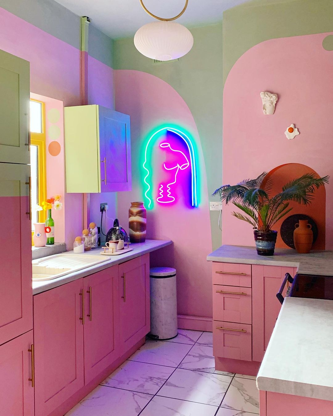 beautiful pink and green kitchen