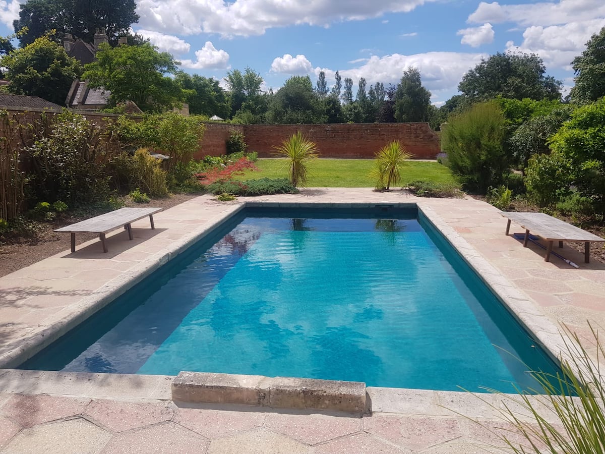 a walled outdoor pool on a Victorian estate