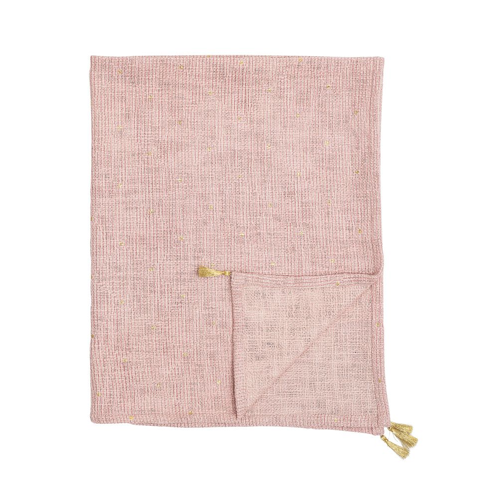 pink tasselled throw