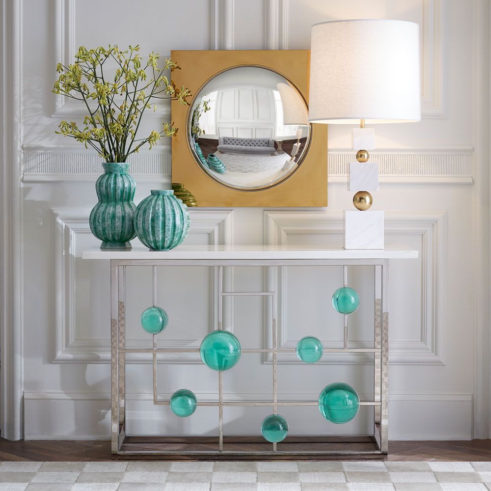 Striking contemporary side table with blue orbs, adorned with turquoise vases and a delightful side lamp
