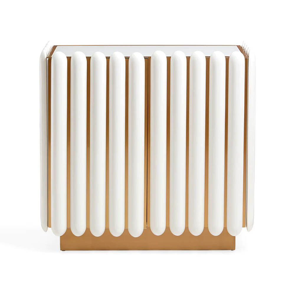 A retro-futuristic inspired cabinet in an ivory finish and brass base