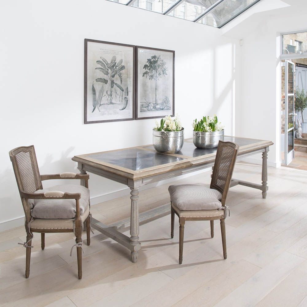 French-inspired dining chair with rattan-style back and removable seat cushion