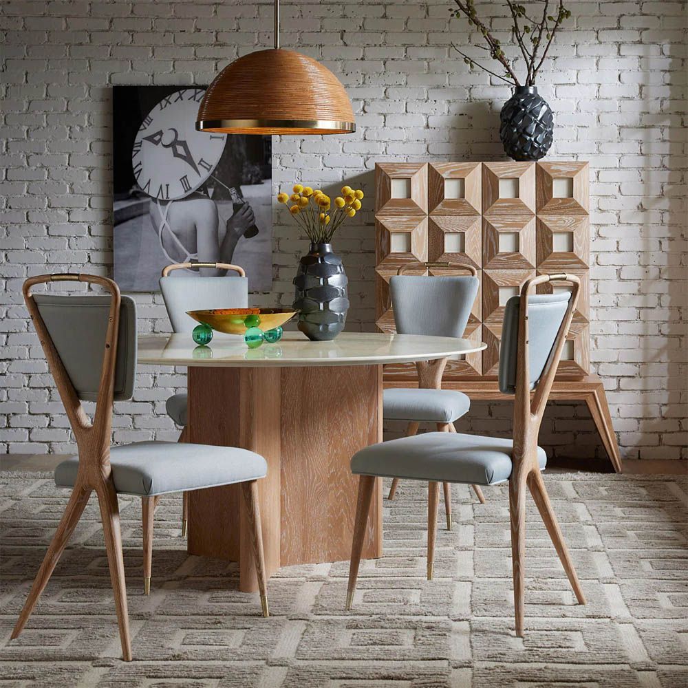 A stylish dining chair by Jonathan Adler with a unique design