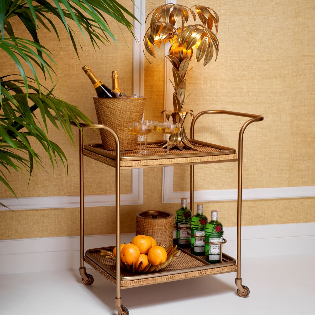 Chic trolley with vintage brass accents and natural rattan tiers