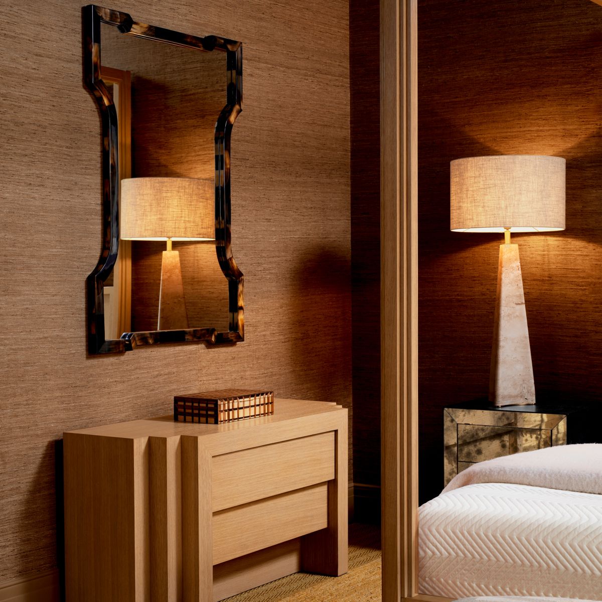 Wall mirror with striking tortoise shell frame