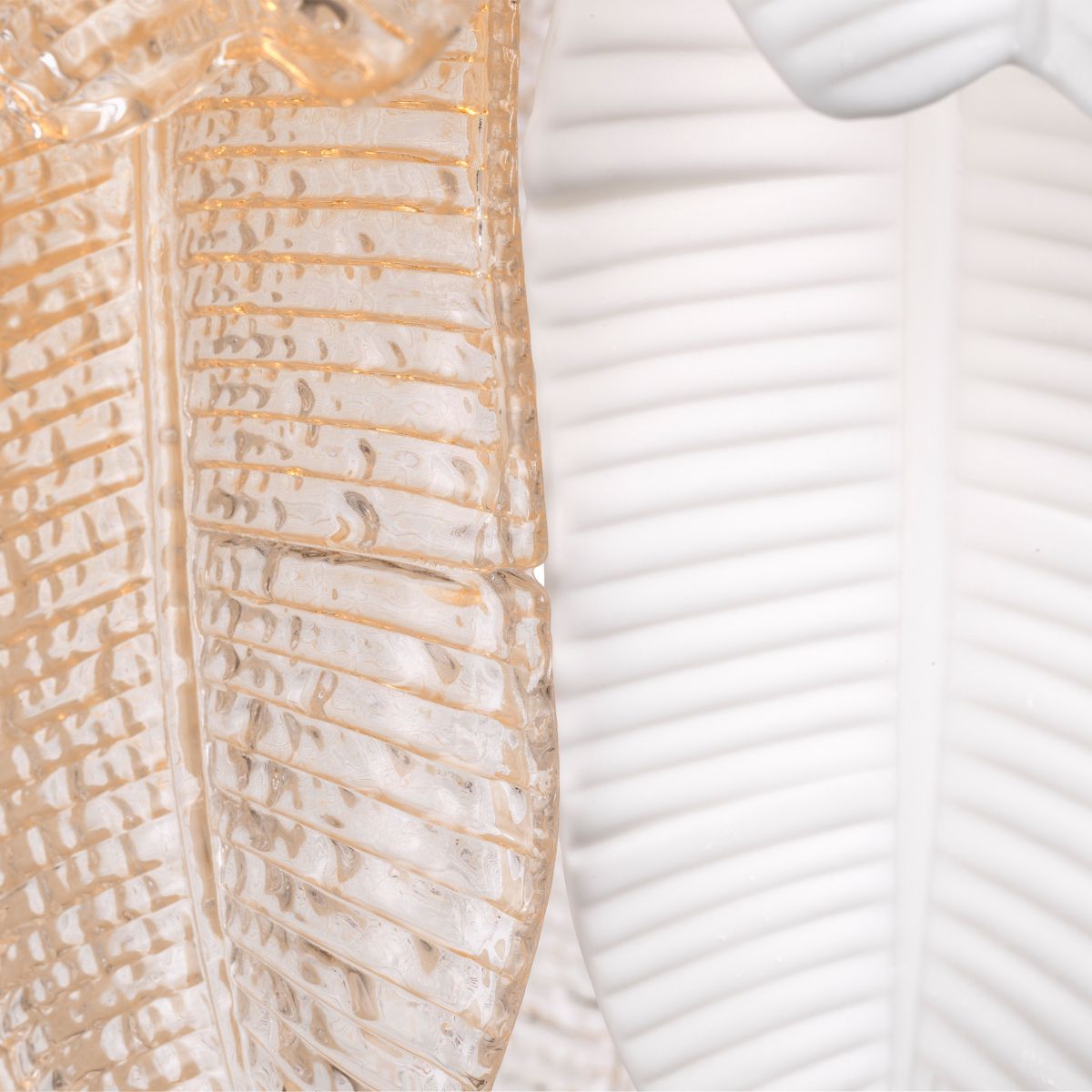 Inspired by the banana tree, the Saint Lucia Chandelier blends ceramic and textured glass, creating a unique and elegant focal point.