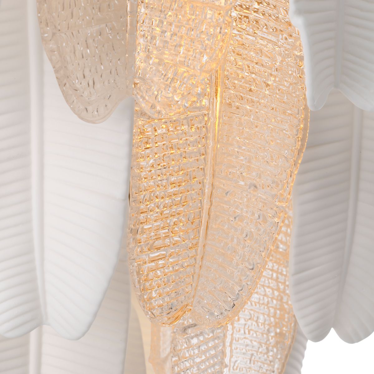 Inspired by the banana tree, the Saint Lucia Chandelier blends ceramic and textured glass, creating a unique and elegant focal point.
