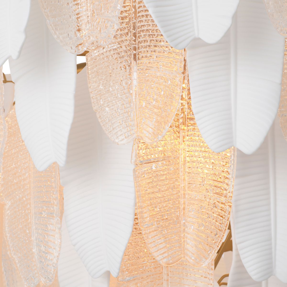 Inspired by the banana tree, the Saint Lucia Chandelier blends ceramic and textured glass, creating a unique and elegant focal point.