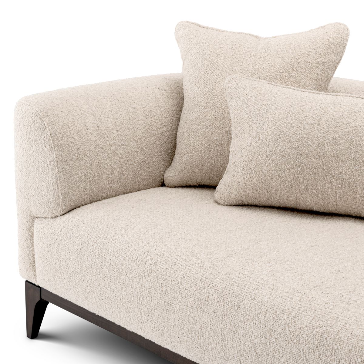Sleek sofa in boucle cream finish with contrasting black base.