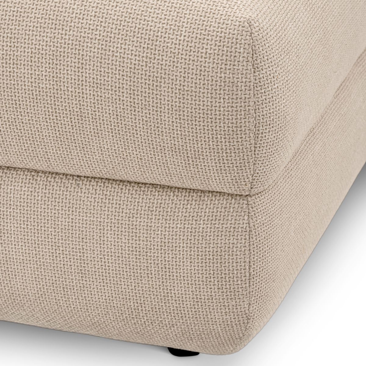 Corner section of modular sofa in boucle cream finish with black feet