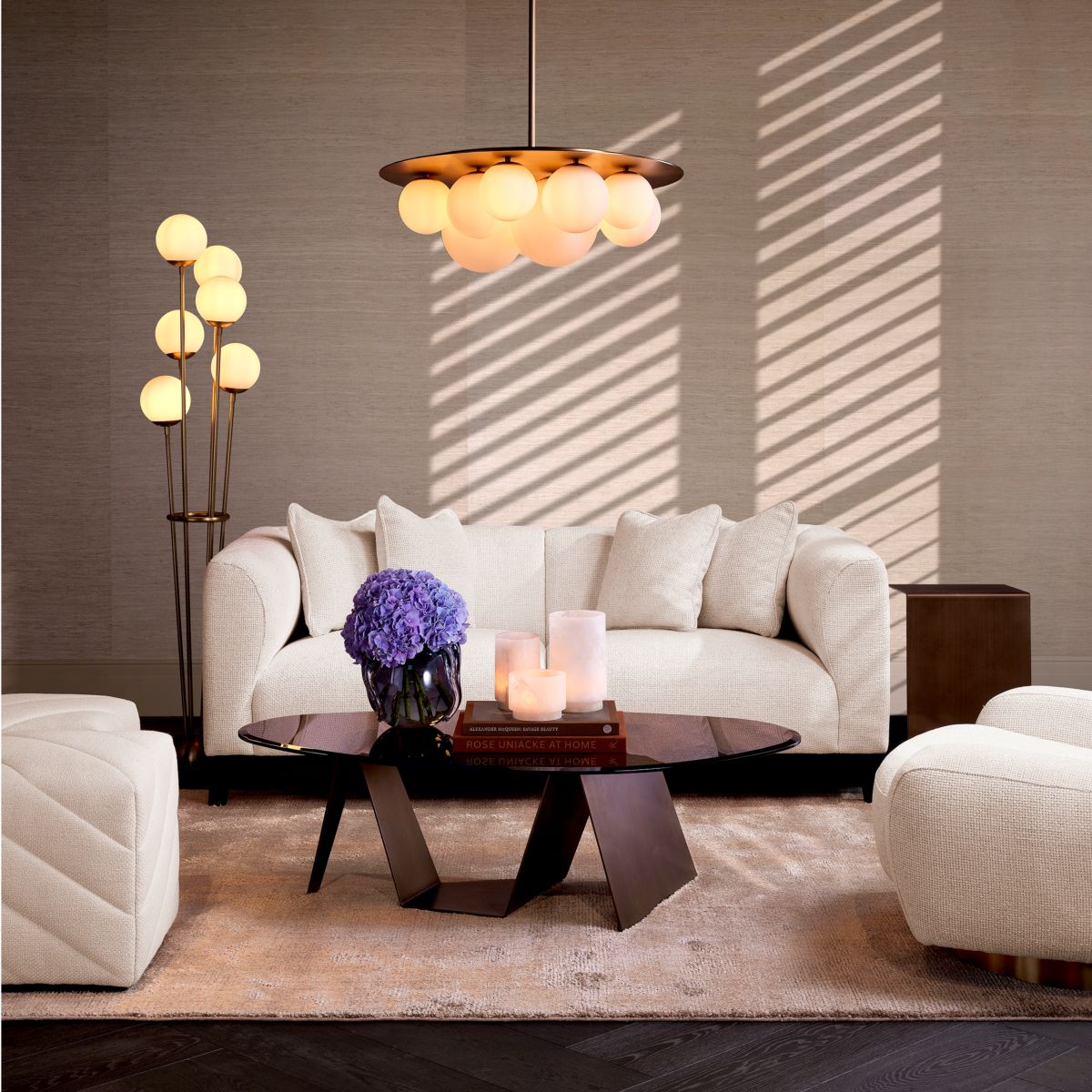 Minimalist style sofa in compact design finished in luxurious off-white fabric.