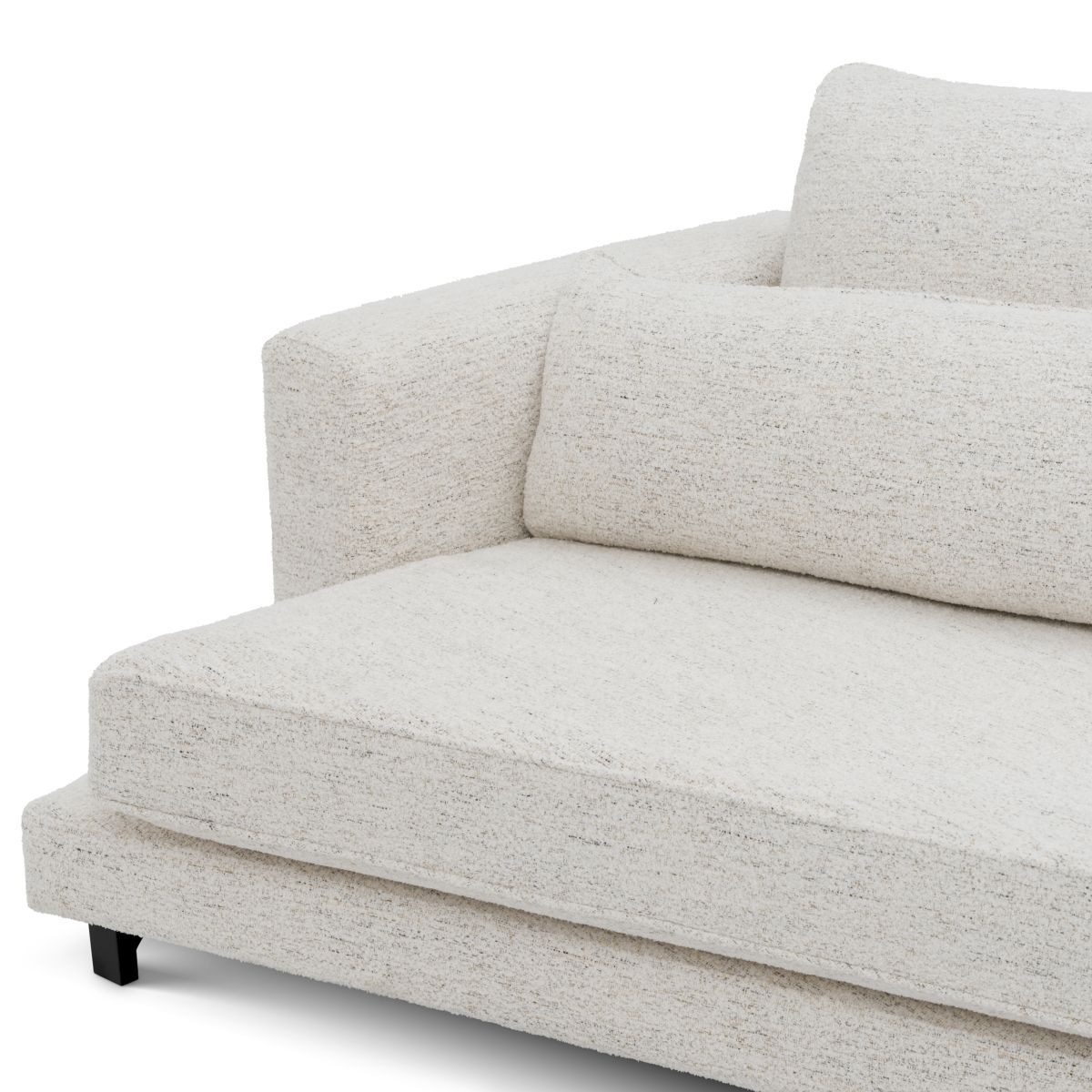 Slightly curved off-white sofa with sleek black feet.