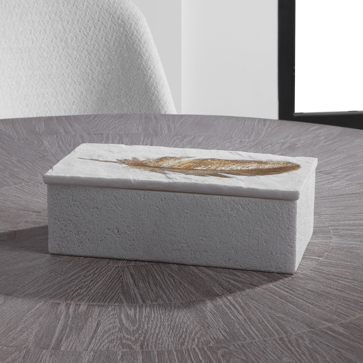 White stone box with gold feather leaf detail 