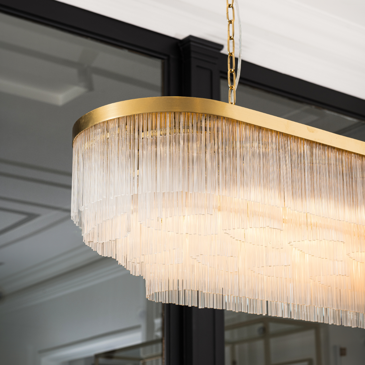 Elevate your space with the Opaline Linear Chandelier from our Luxe Collection. Elegant design meets ambient lighting for a stunning focal point.