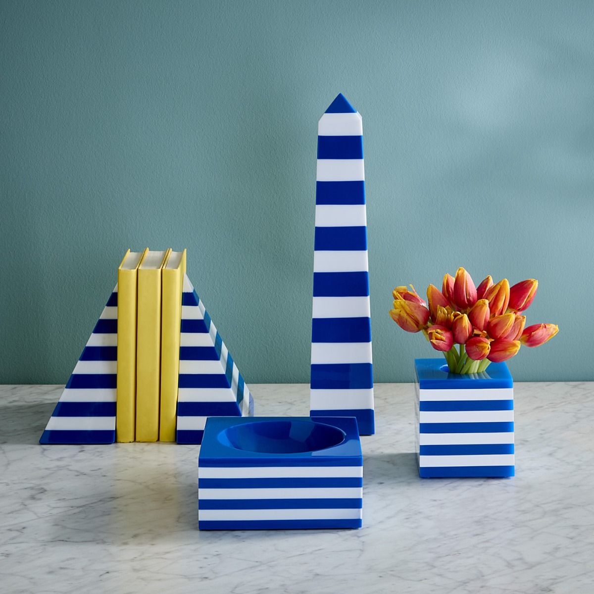 Bold blue and white striped bookends crafted from hand-poured acrylic, adding chic, nautical style to any shelf.