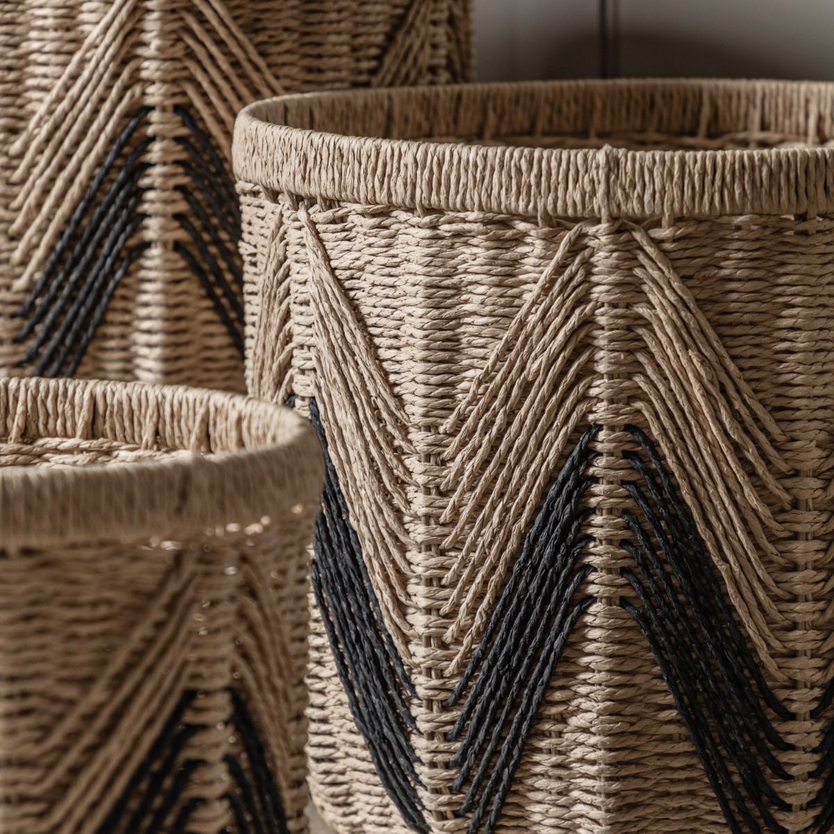 Set of three woven baskets with black detailing
