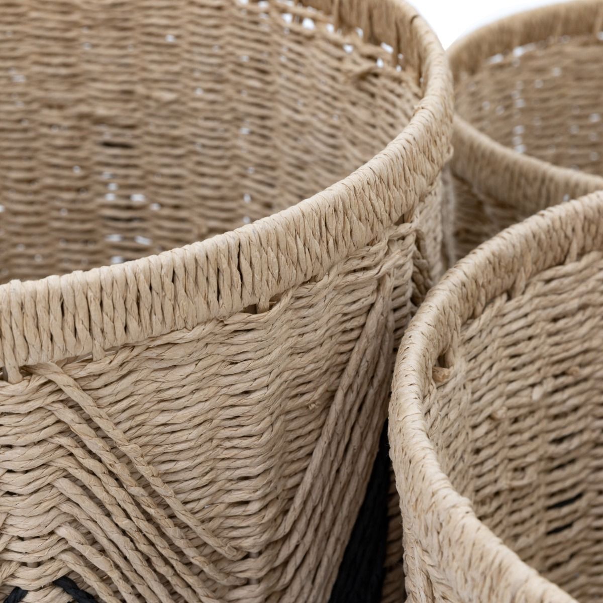 Set of three woven baskets with black detailing