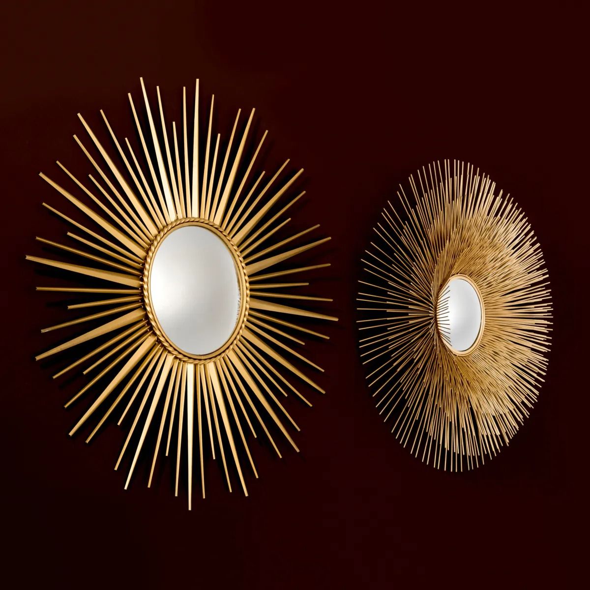 Radiant golden wall mirrors with spiked details