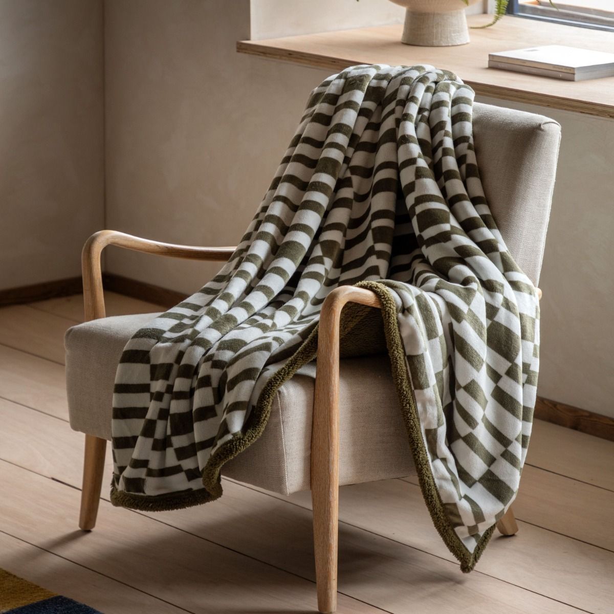 Wrap yourself in comfort with the Shiloh Throw in Olive. Perfect for cozy nights, it adds a touch of style to any space. Soft and stylish!
