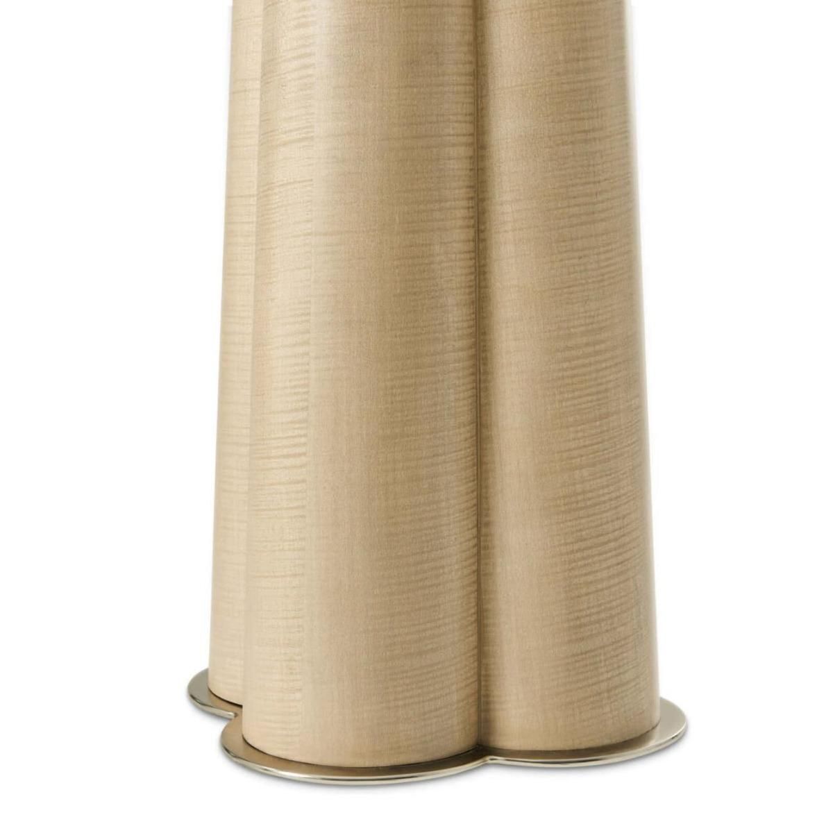 Floor lamp with a sculptural base and white linen shade