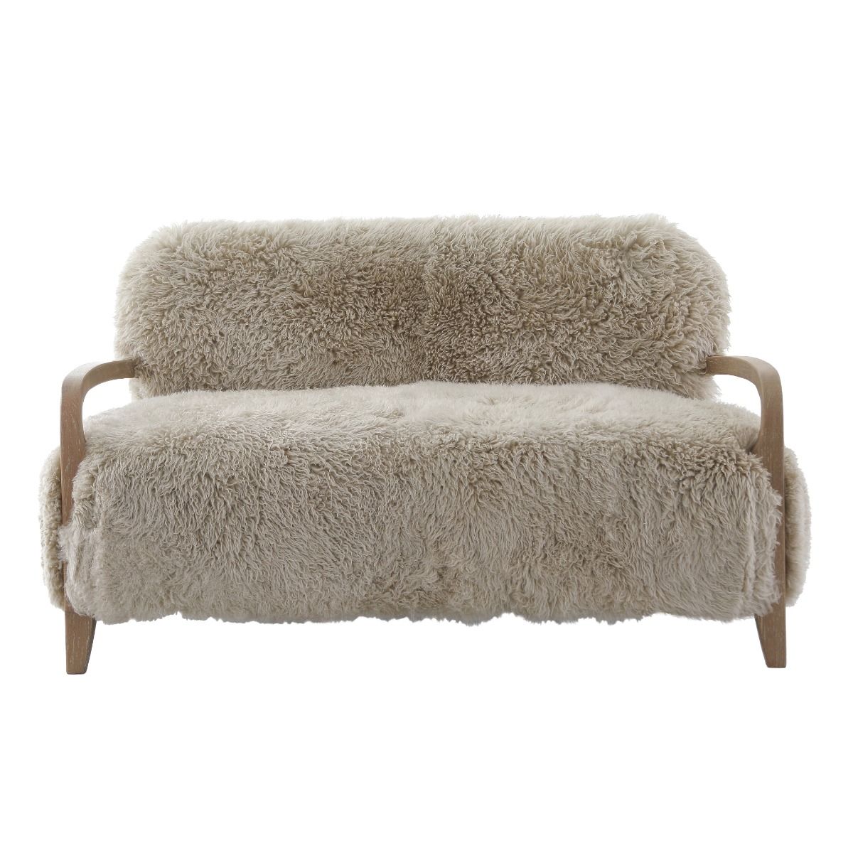 Upholstered in luxurious sheepskin with curved oak arms, the Baaarb Sofa adds a refined yet edgy touch to any modern interior and pairs perfectly with the Baaarb Accent Chair and Ottoman.