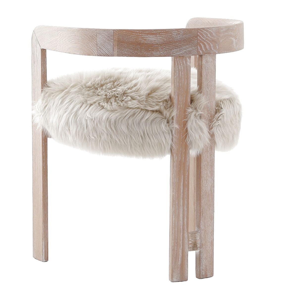 The Baaarb Dining Chair, with its real cream sheepskin seat and solid oak frame, exudes luxurious contemporary style and texture, making it a striking addition to any dining space.