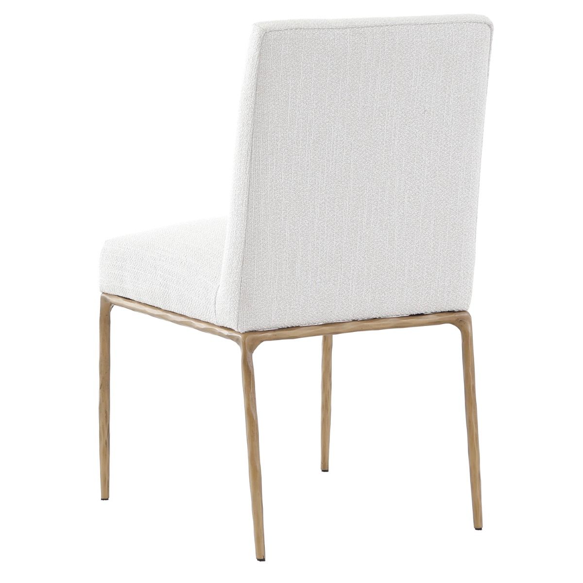 The Sloane Dining Chair, with its brass gold metal legs and off-white C0 fabric upholstery, effortlessly adds a chic mid-century modern touch to any dining space.