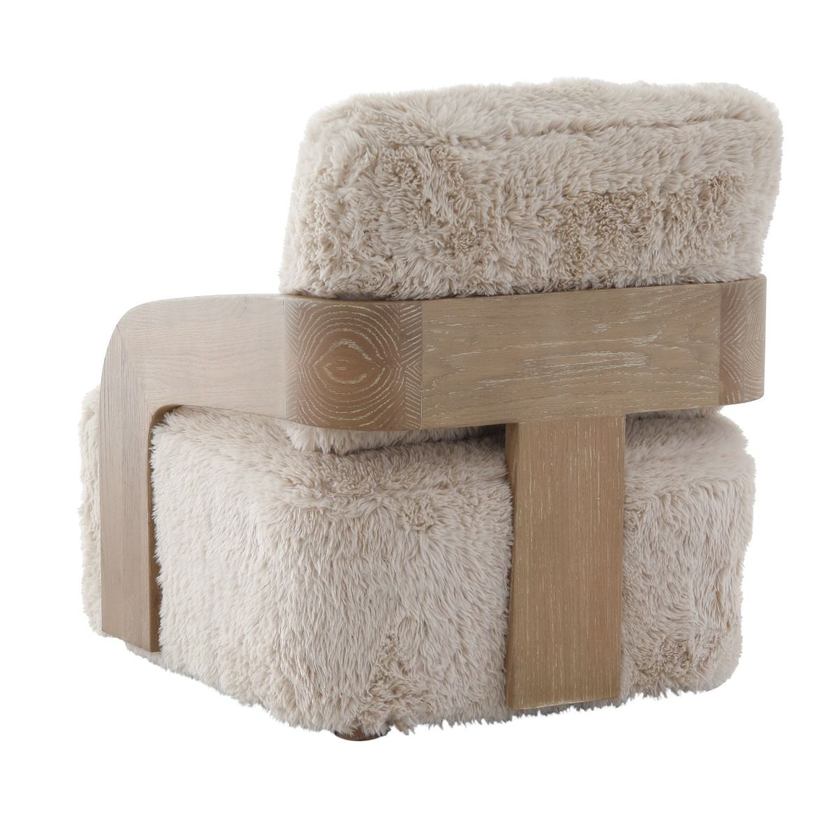 The Winnie Accent Chair, with its solid oak frame and sand-coloured faux fur upholstery, offers a cocoon of comfort and refined elegance