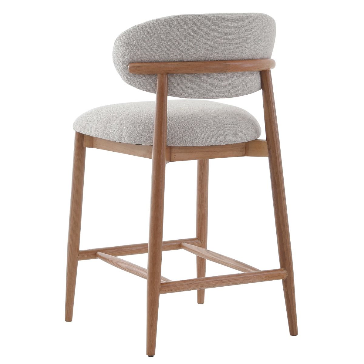 The Blockley counter stool, with its sleek curves, premium linen upholstery, and solid oak frame, adds modern style and durability to any kitchen, complemented by a matching Dining Chair.