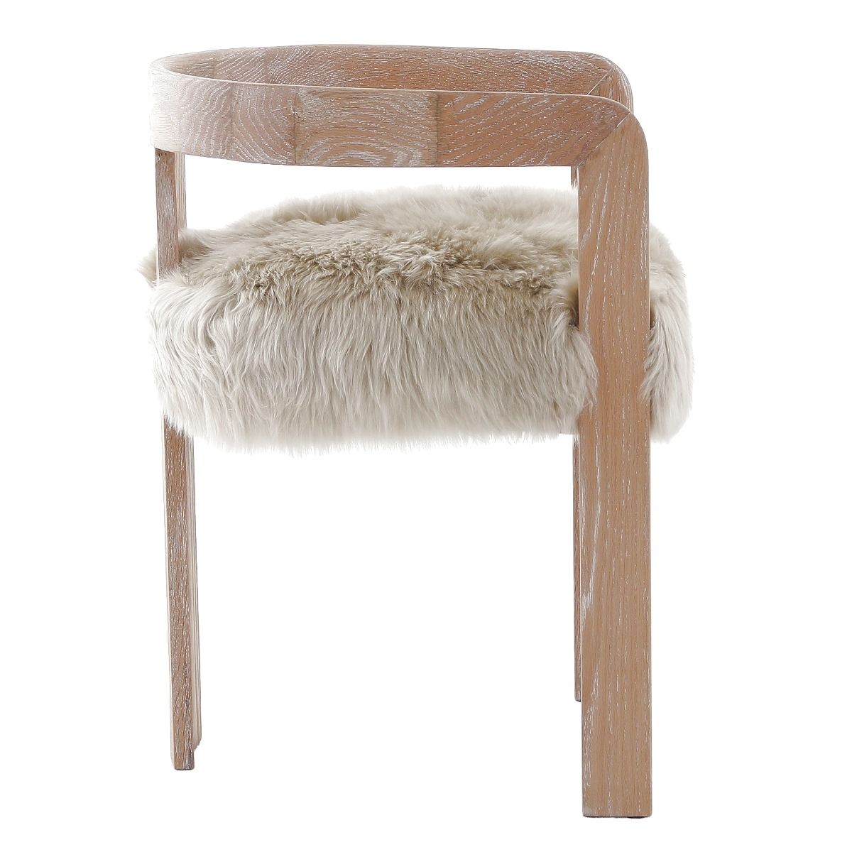 The Baaarb Dining Chair, with its real cream sheepskin seat and solid oak frame, exudes luxurious contemporary style and texture, making it a striking addition to any dining space.