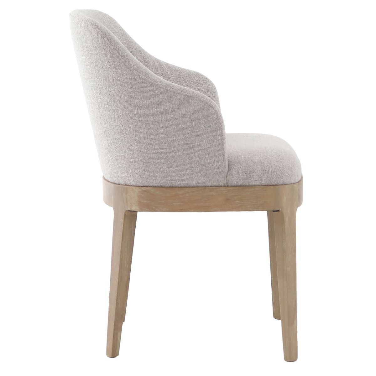 The Kingham Dining Chair features a solid oak frame, exposed seat, and luxurious linen upholstery, offering a timeless and elegant choice for everyday dining.