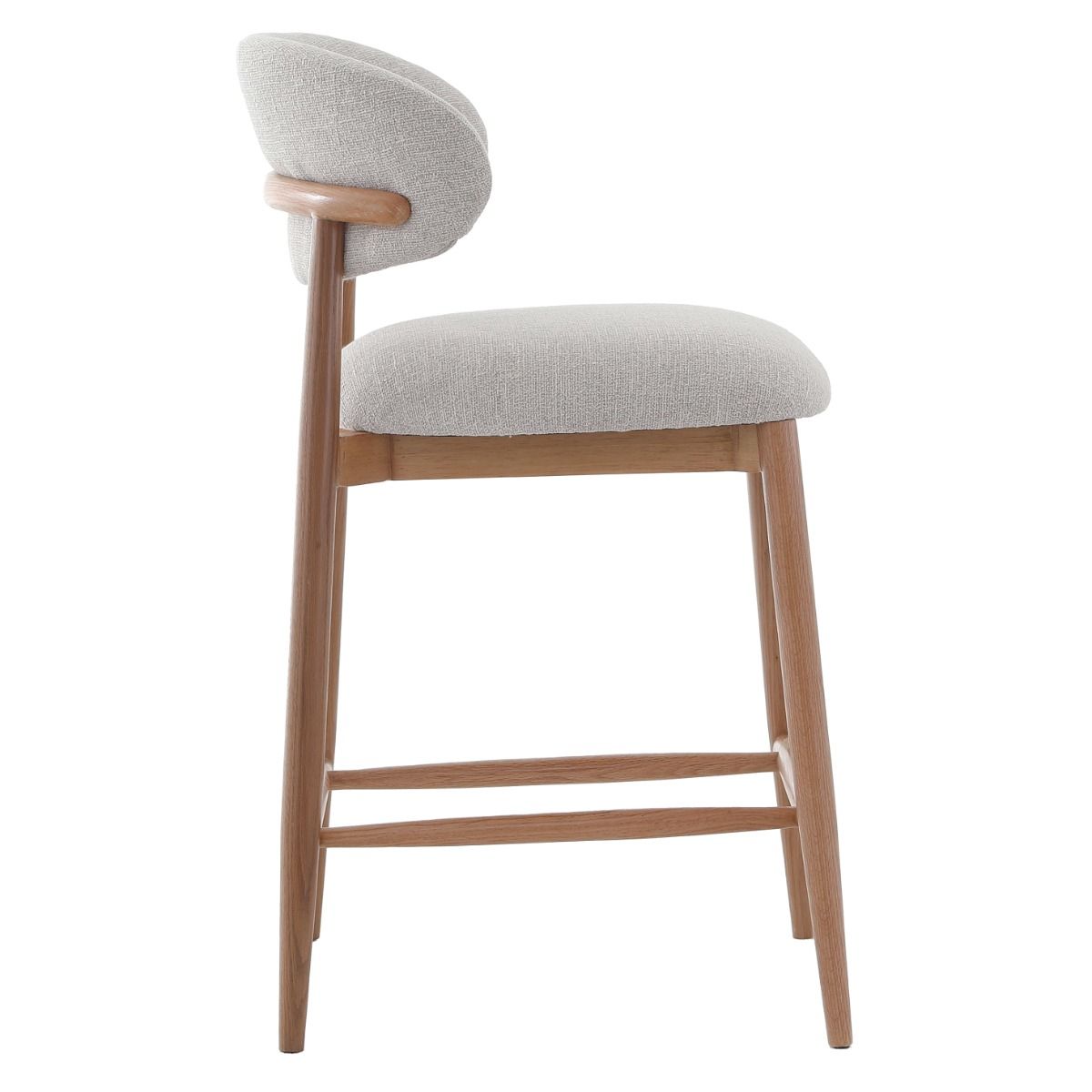 The Blockley counter stool, with its sleek curves, premium linen upholstery, and solid oak frame, adds modern style and durability to any kitchen, complemented by a matching Dining Chair.