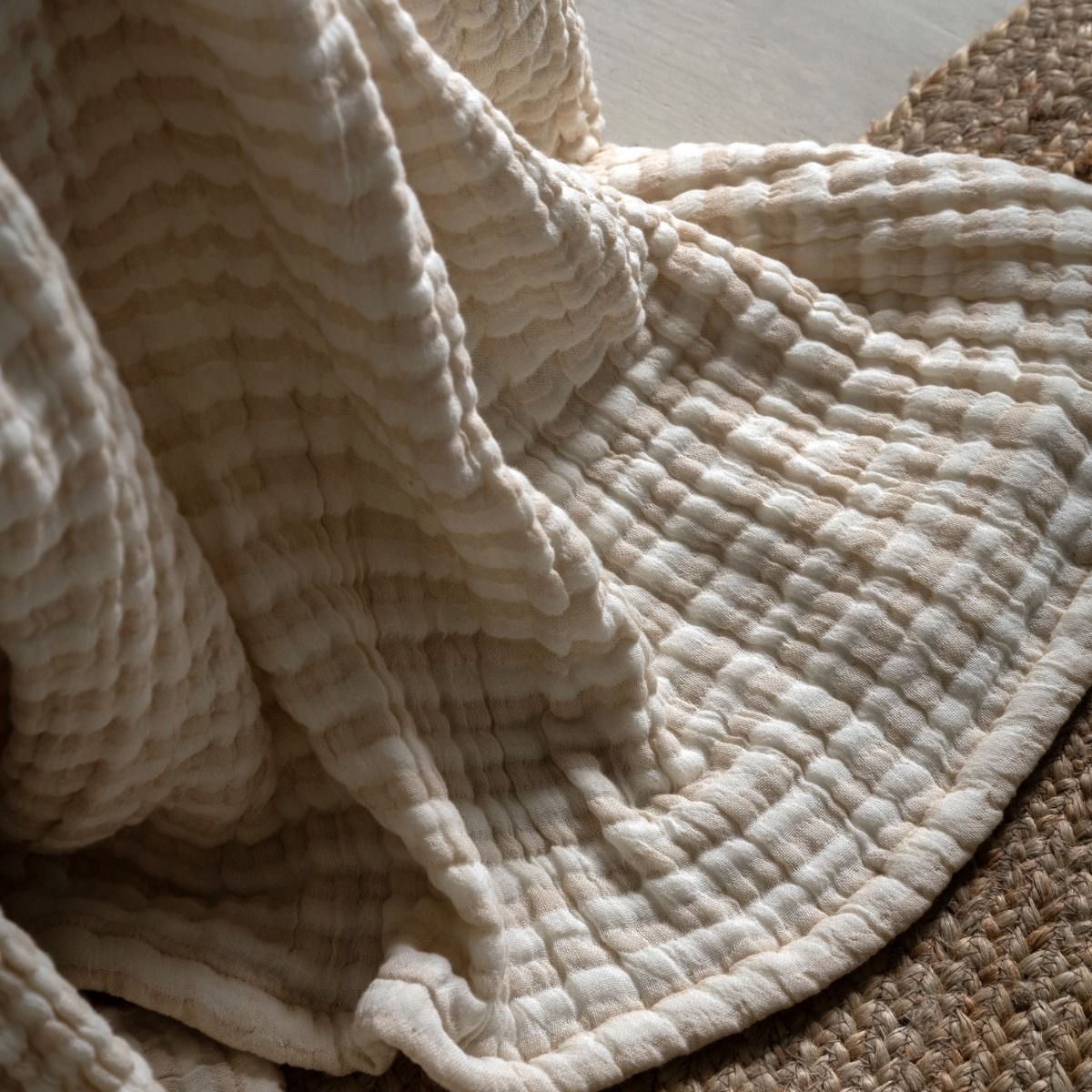 Beige crinkle stripe bedspread