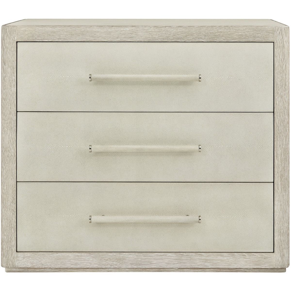 Three drawer bedside table in light wood