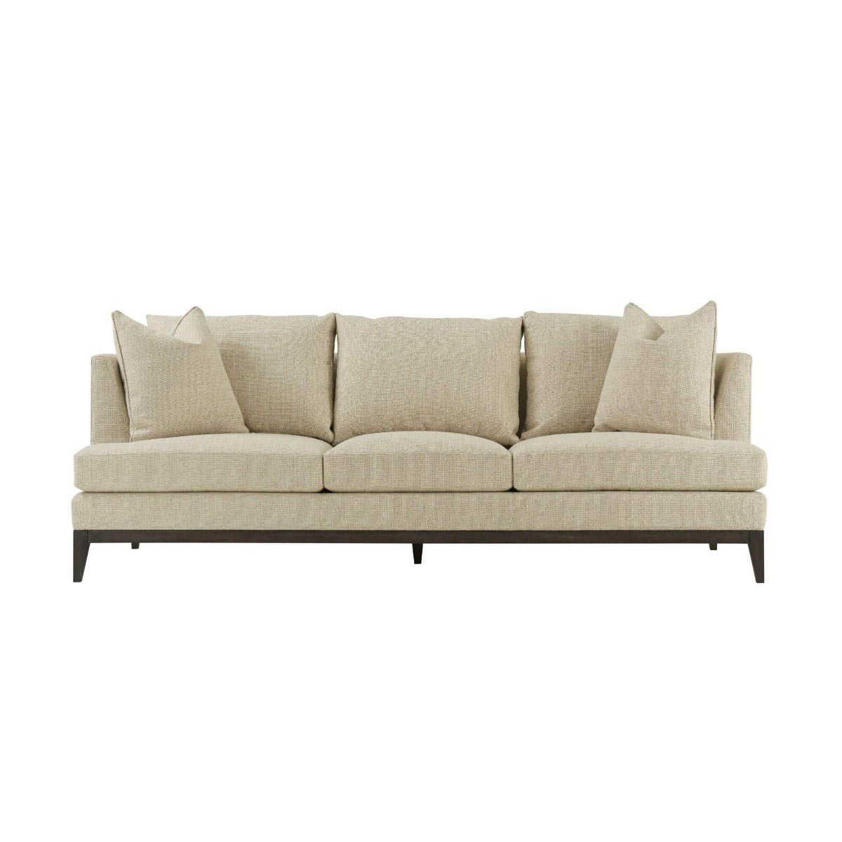 Natural upholstered three seater sofa with dark brown wooden legs