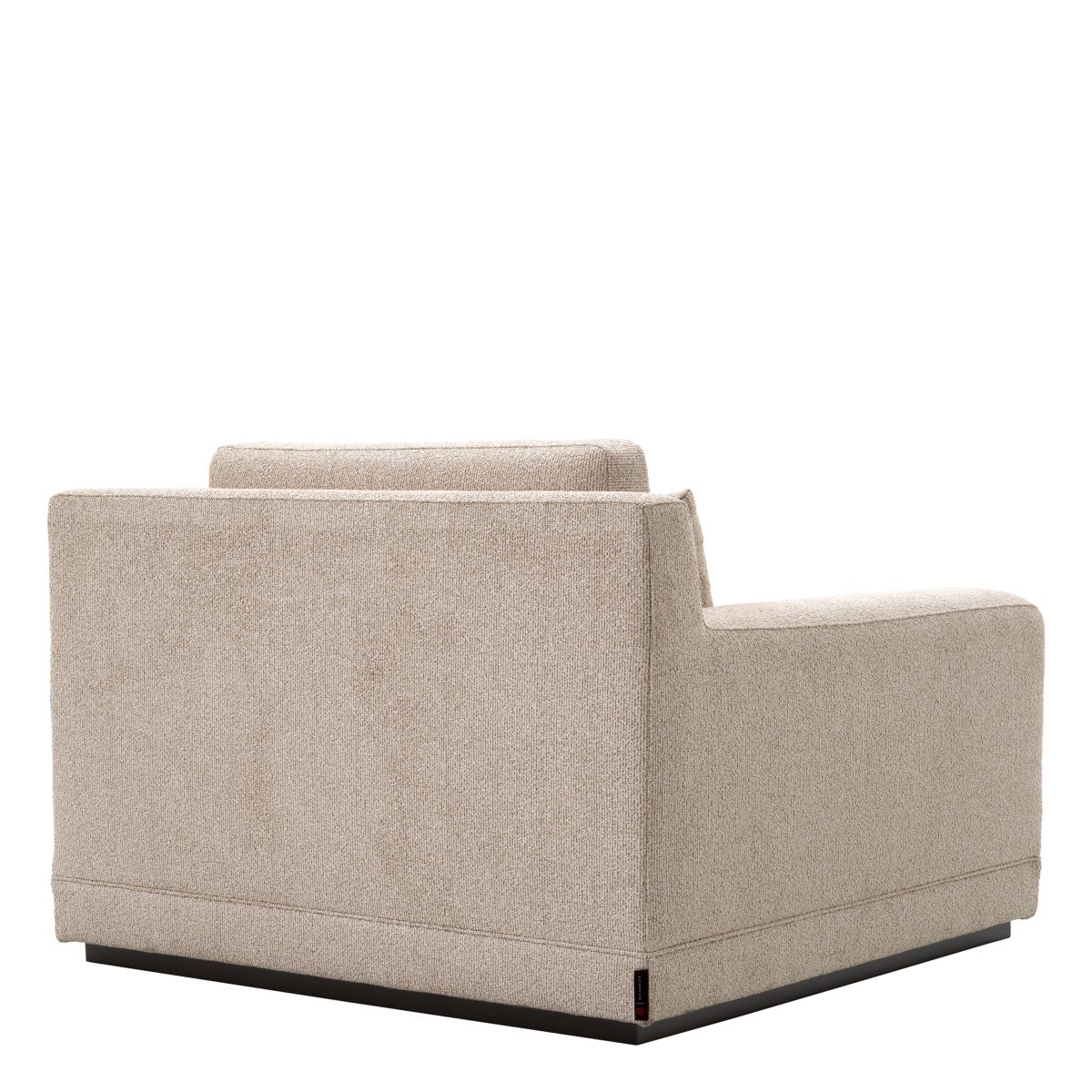 A sophisticated armchair with a luxury beige upholstery