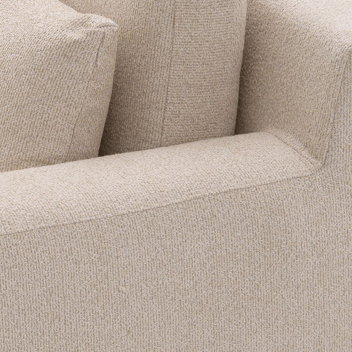 A sophisticated armchair with a luxury beige upholstery