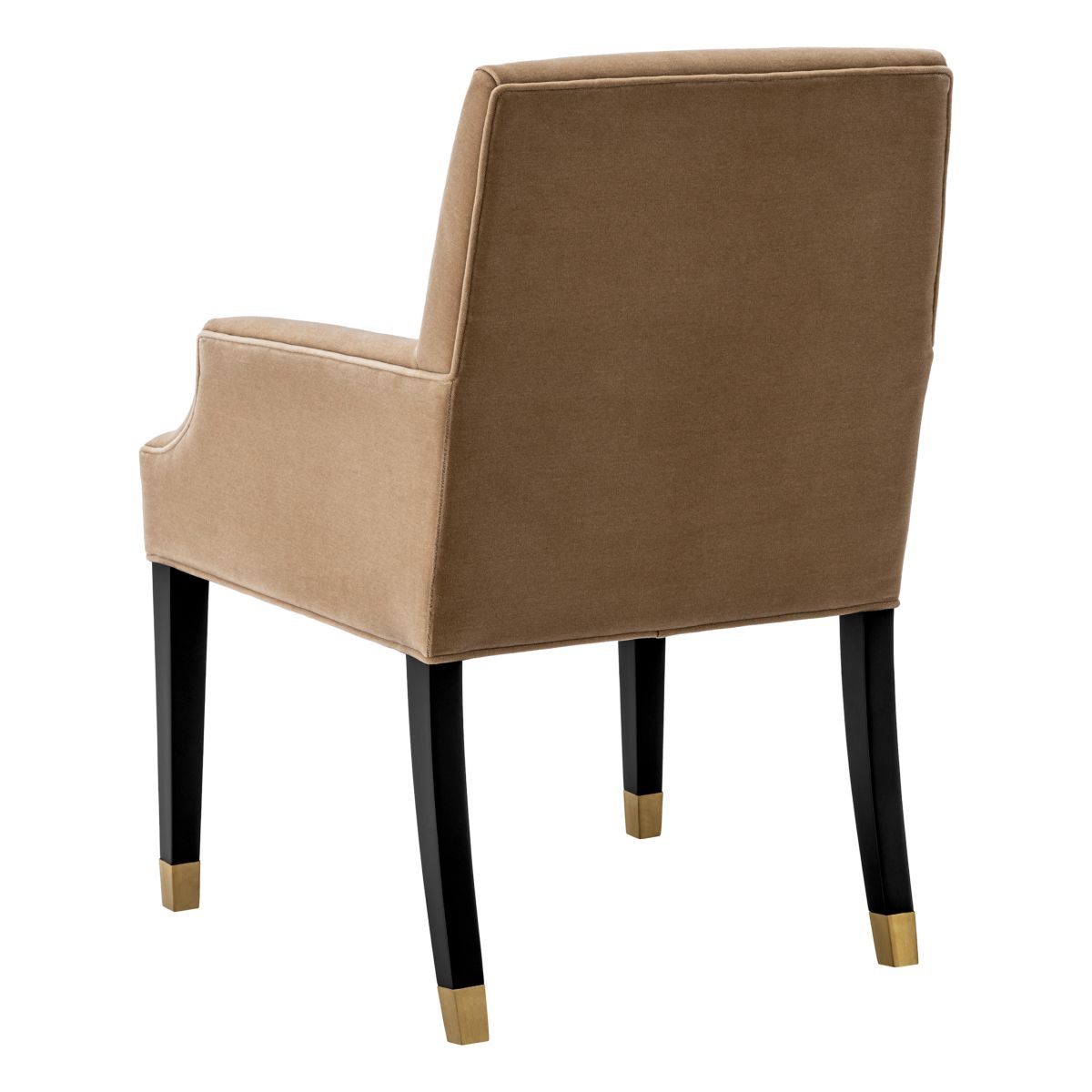 A classic dining chair with a camel velvet upholstery