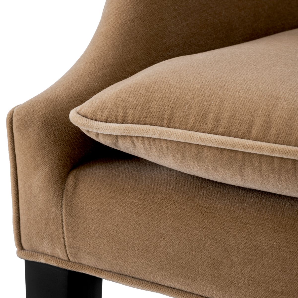 A classic dining chair with a camel velvet upholstery