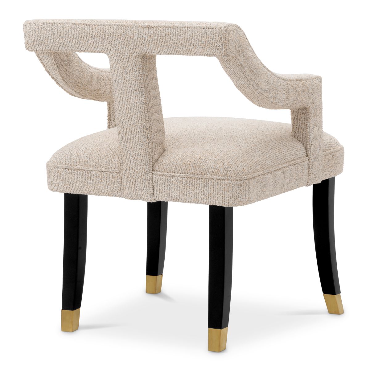 A stylish dining chair with a distinctive silhouette and luxury beige upholstery