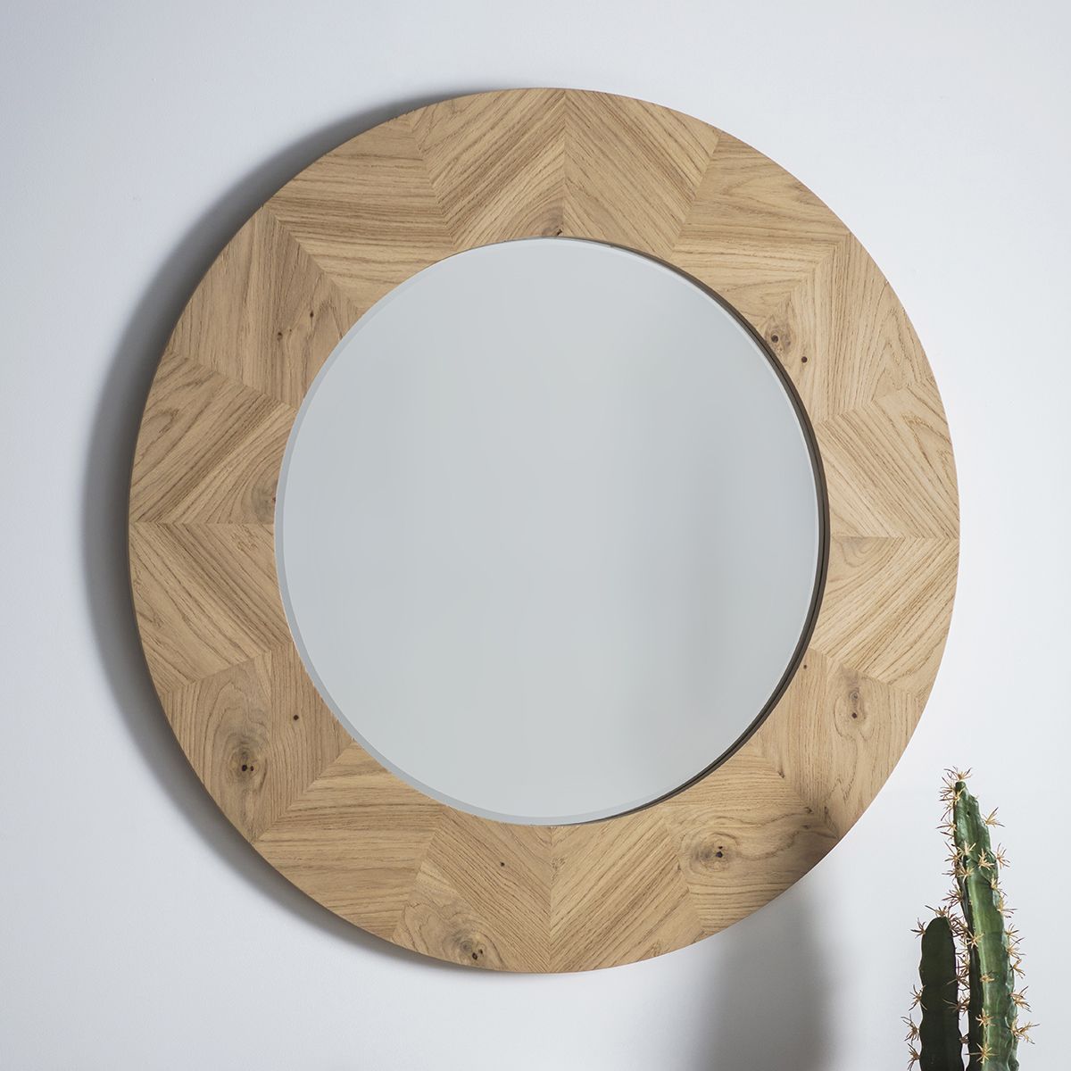 Warm wooden circular mirror with chevron design