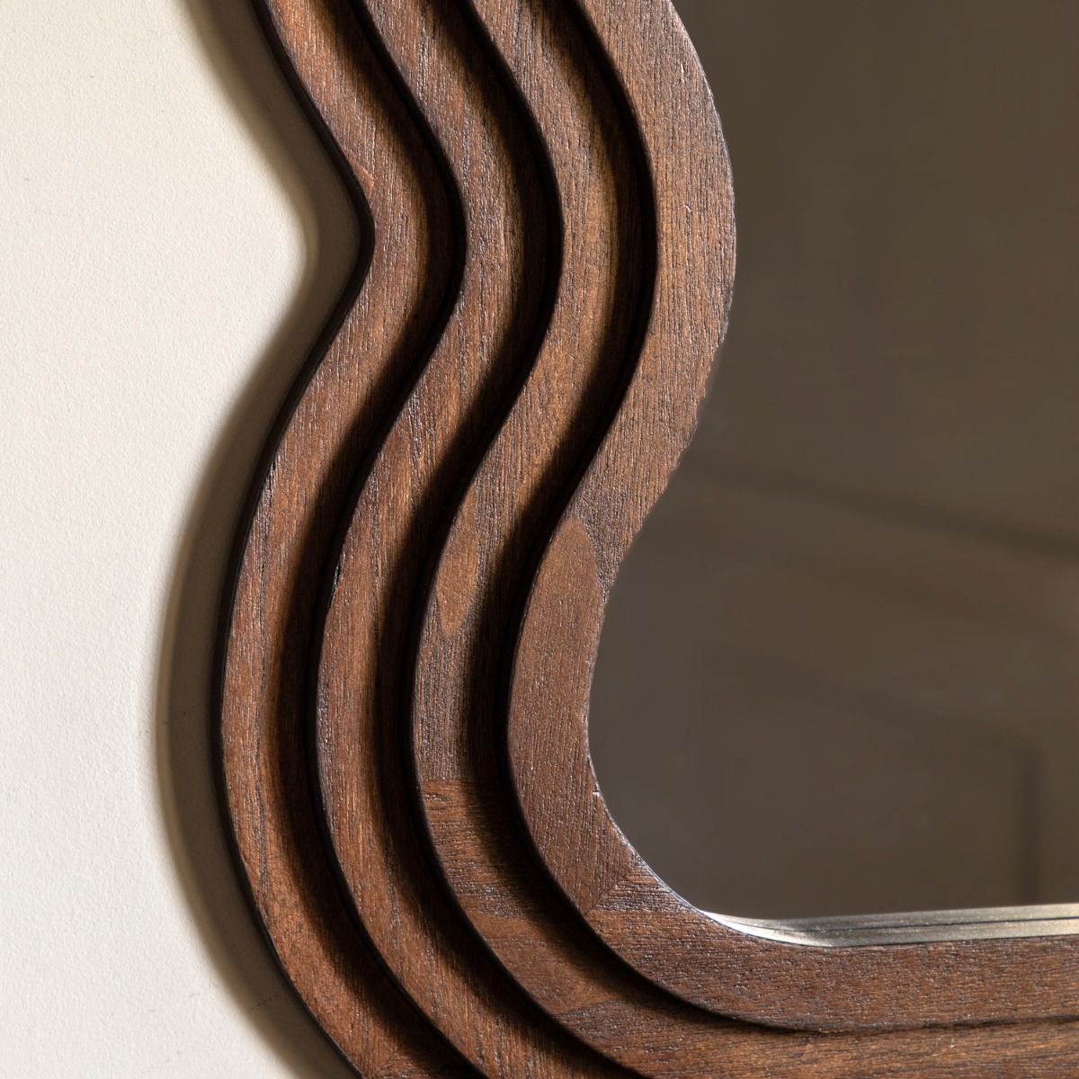 Brown wooden mirror with wavy edge frame