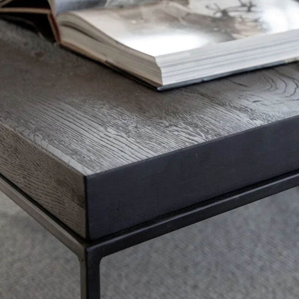 Square side table with black metal legs and black wooden tabletop