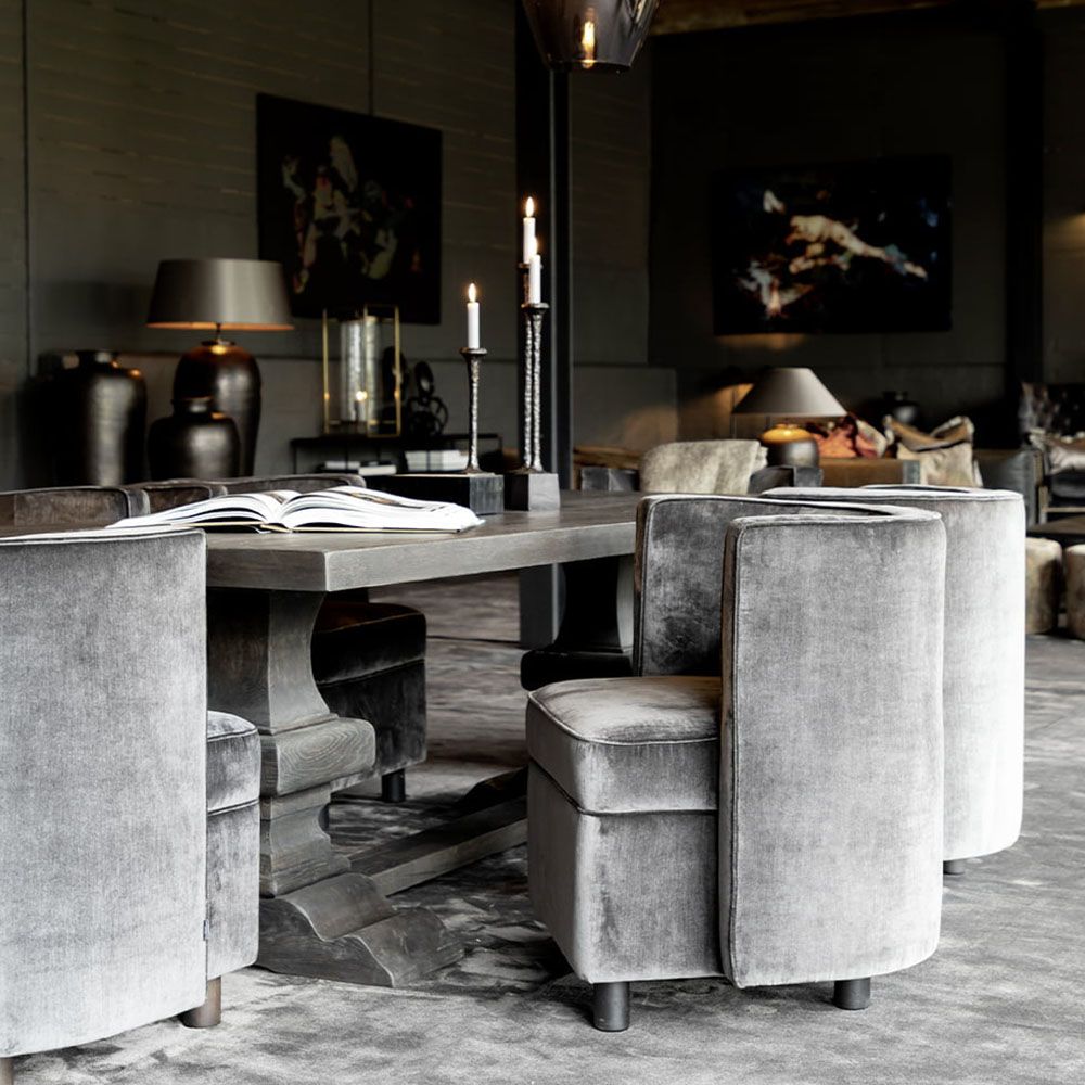 Large rectangular dark brown dining table with ornate layered legs