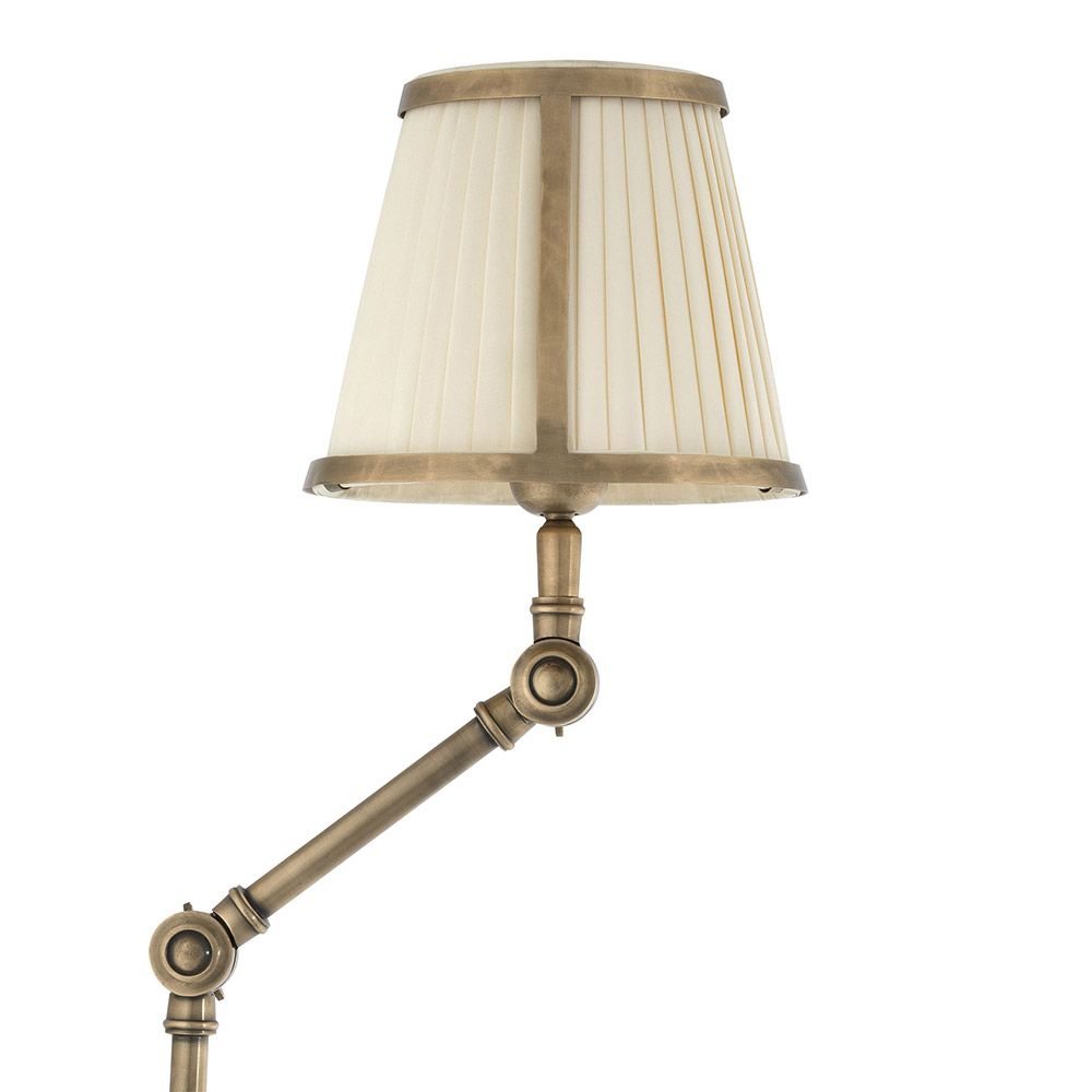 Elegant wall lamp with graceful stem and choice of black or cream lampshade