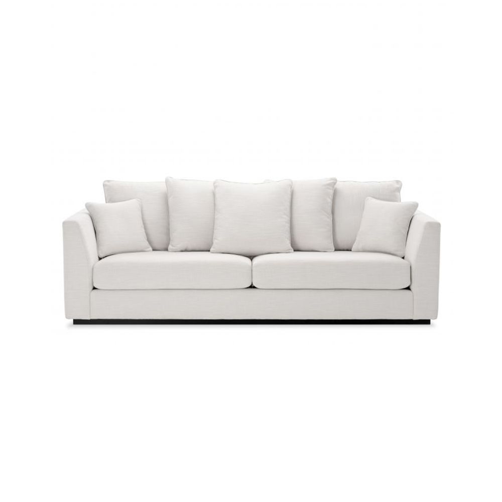 A luxury sofa by Eichholtz with a choice of Avalon White, Boucle Cream or Mademoiselle Beige upholstery, black base and seven cushions
