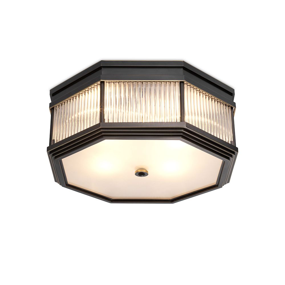 An industrial style chandelier by Eichholtz with a bronze finish